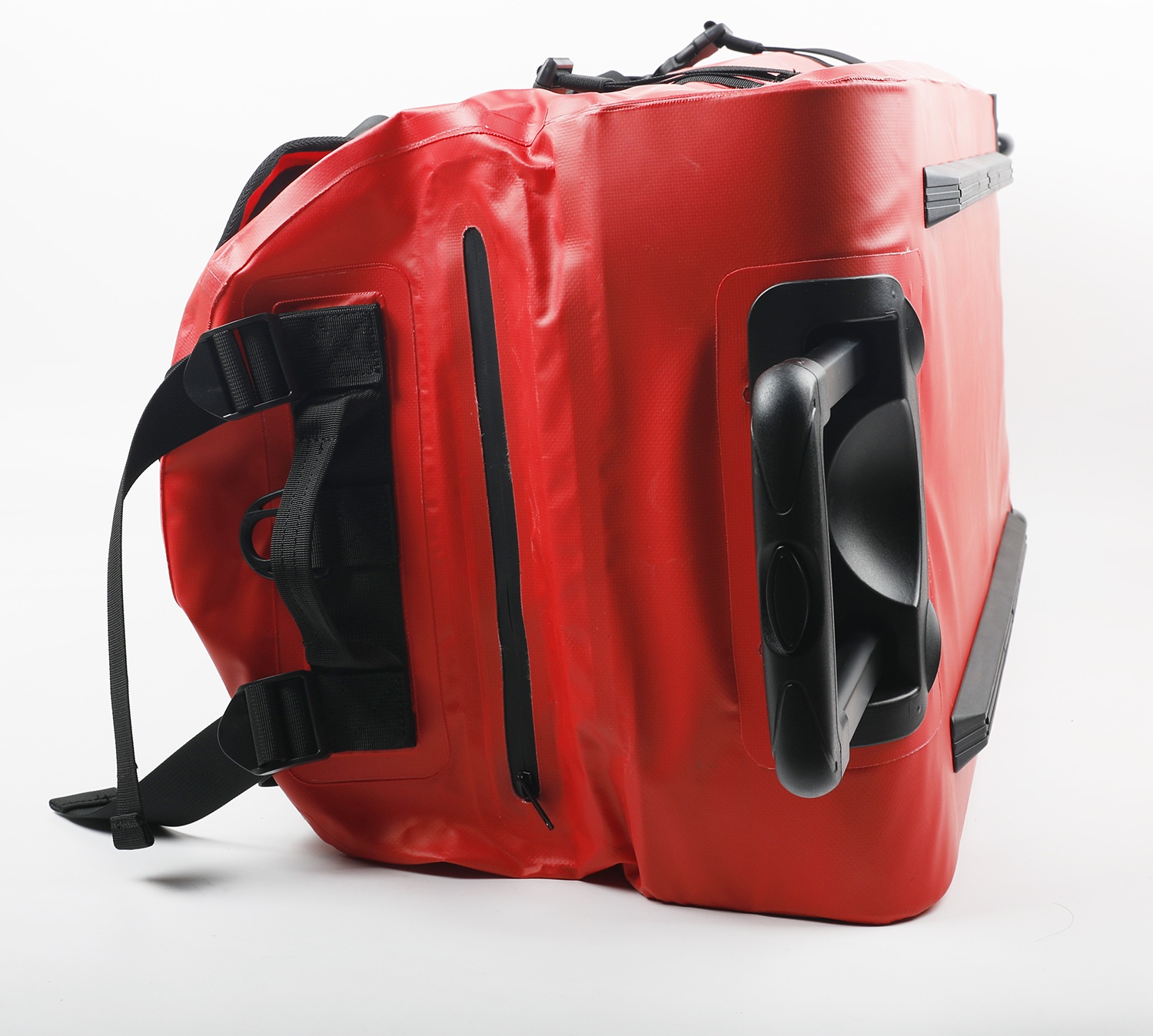Side view of wheel housing and red coated duffel shell