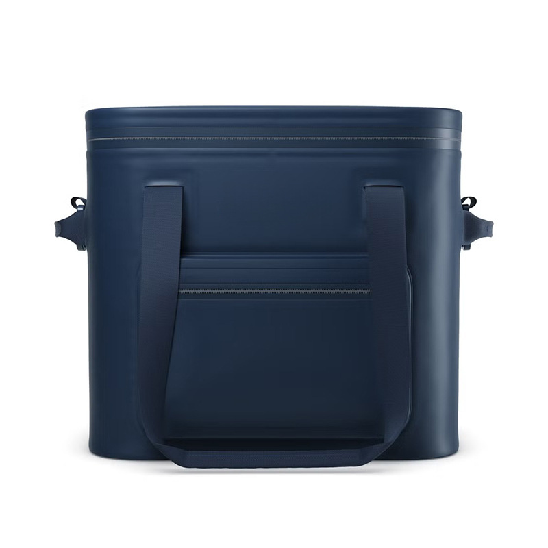 Front storage pocket and webbing handles on navy soft cooler