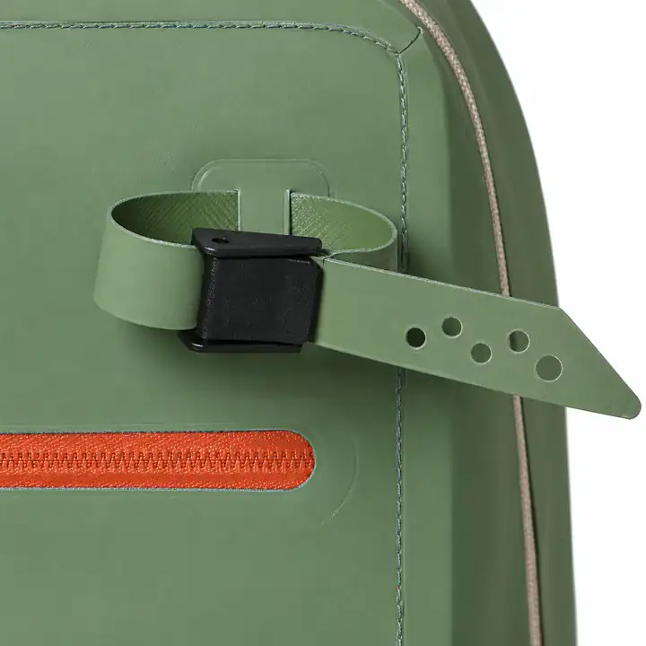 Perforated exterior gear strap and black buckle on the olive 20L backpack