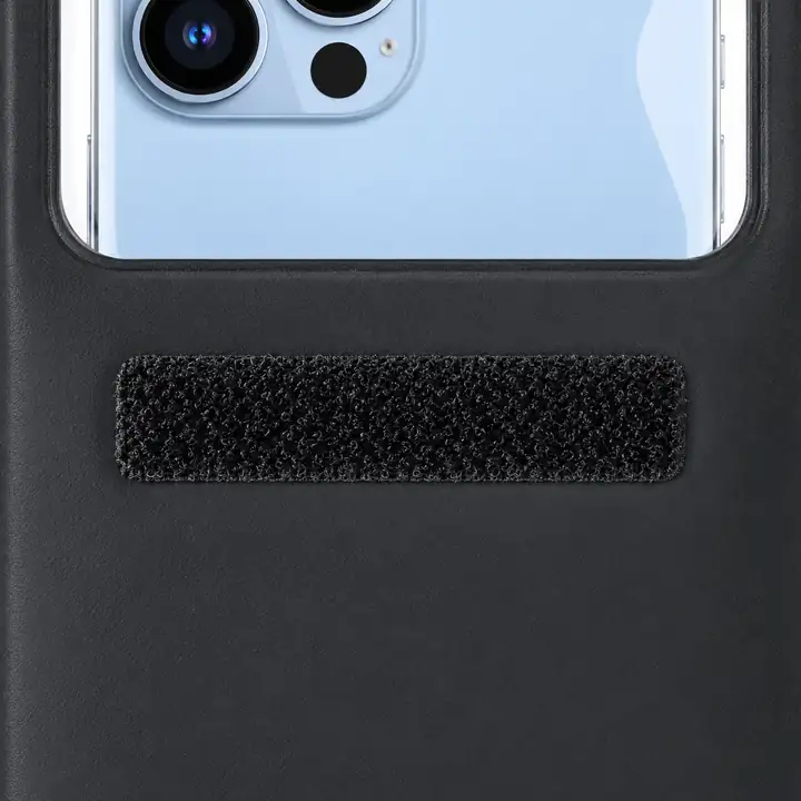 Hook-and-loop fastener patch below the rear window of the black phone pouch