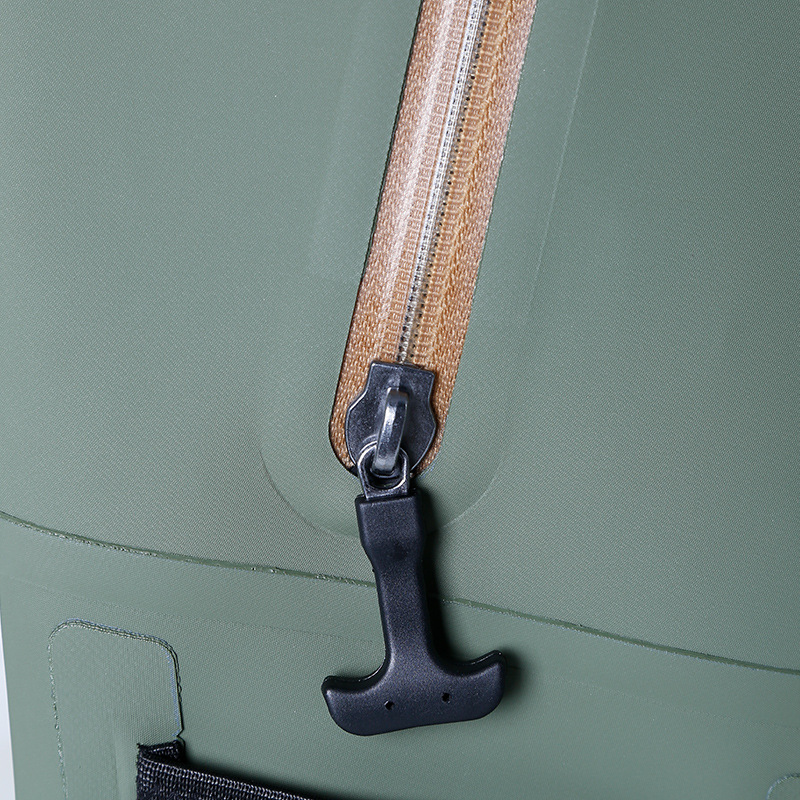 Close-up of zipper pull and coated olive backpack shell
